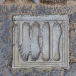 Carved footprints in the city of Italica