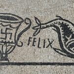 Swastika on a Roman mosaic shown with a fish and the inscription FELIX  meaning happy