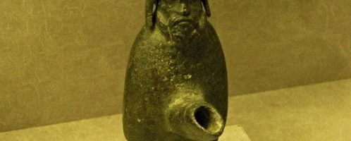 Roman lamp depicting the Gallic deity Cucullatus