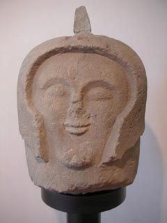 Fragment of a sculpture showing the head of an Etruscan warrior