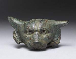 Ornament of Roman furniture made of bronze, in the shape of a dog's head
