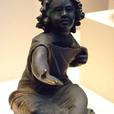 Piggy bank for coins in the form of a begging girl