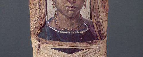 Portrait of young woman stuck to mummy