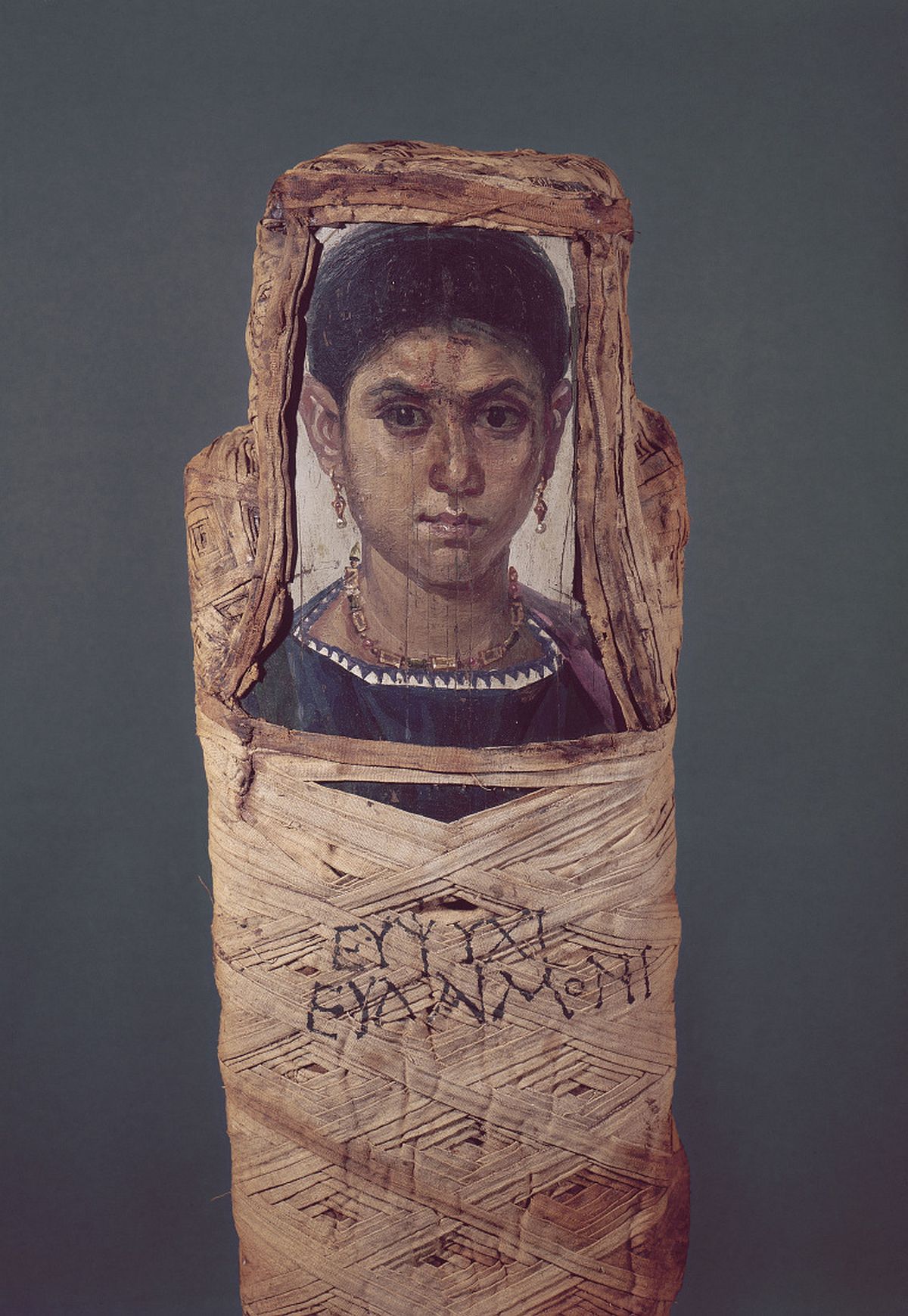 Portrait of young woman stuck to mummy