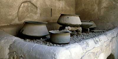 Roman kitchen with utensils in House of Vettii