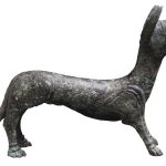 Roman figurine of a licking dog