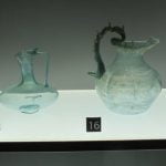 A collection of Roman glass vessels in the collection of the Museum at Castle Colchester, erected on the foundations of the Temple of Claudius