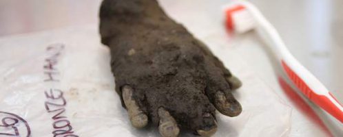 A bare bronze arm in the Roman camp of Vindolanda