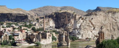 View of the ancient Roman city of Hasankafe (Turkey) carved out of the  rock