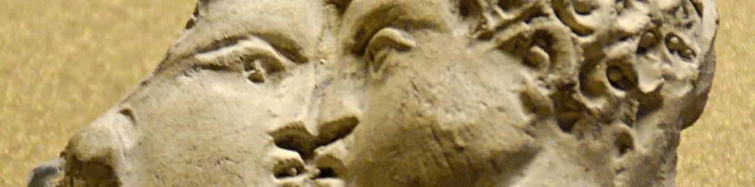 Roman clay fragment with relief decoration depicting a couple kissing.