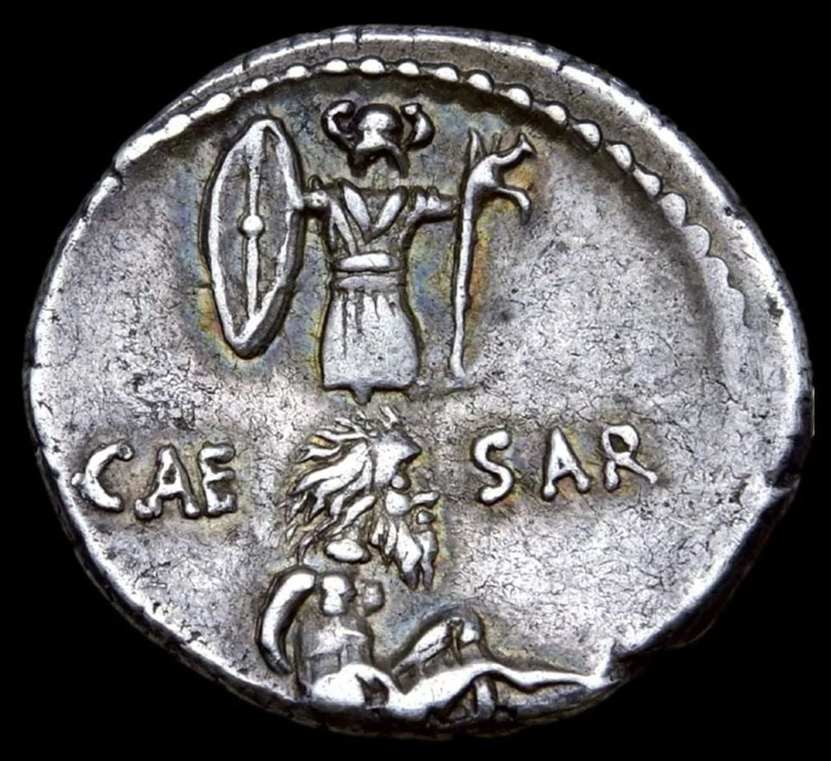 Roman coin commemorating Caesar's triumph
