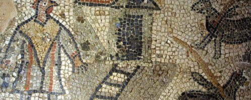 A man with a rooster's head on a mosaic