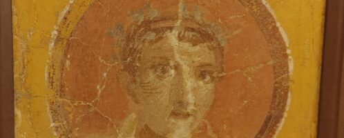 Roman fresco showing young man with wreath