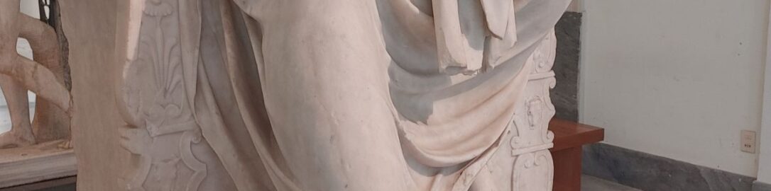 Fragment of Roman sculpture showing Jupiter seated on throne