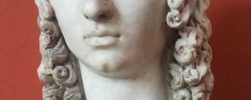 Roman woman with lush curls on sculpture