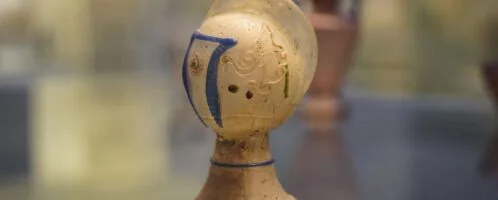 Roman glass vessel in shape of gladiator's helmet