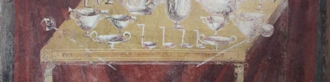 Roman fresco showing table covered with dishes