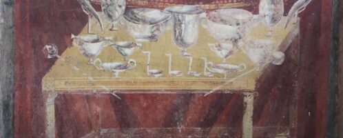 Roman fresco showing table covered with dishes