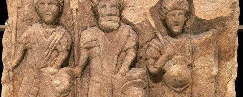 Fragment of Roman tombstone showing three legionaries
