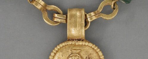 Gold necklace with goddess medallion